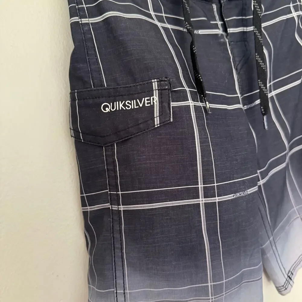 Quiksilver Board Shorts Featuring a Black and White Plaid Design